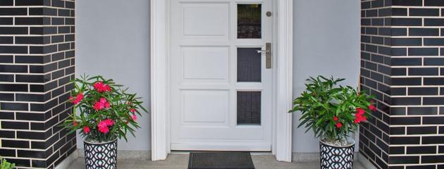 Standard white front door on a modern Canadian home