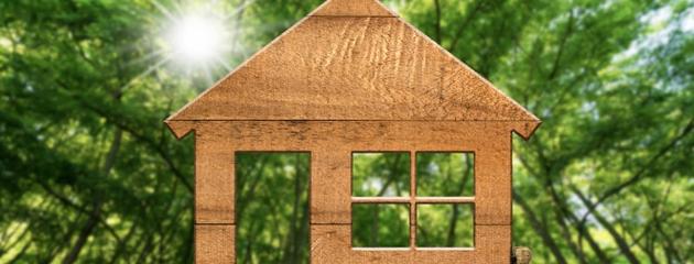 Gloved hand holding eco-friendly window frame sample — representing sustainable materials for Canadian homes.