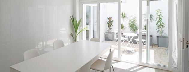 Modern kitchen and dining area with large sliding glass doors