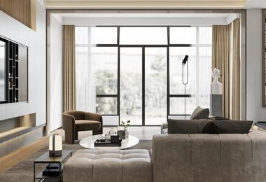 Modern living room with floor-to-ceiling windows bringing abundant natural light and outdoor views
