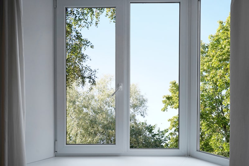 View through a modern energy-efficient window overlooking a green garden