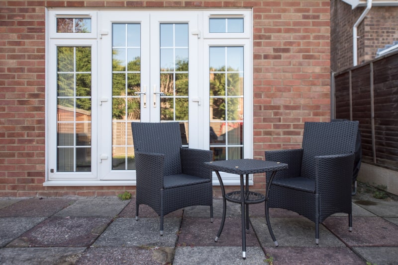 Canadian home exterior featuring large sliding patio doors