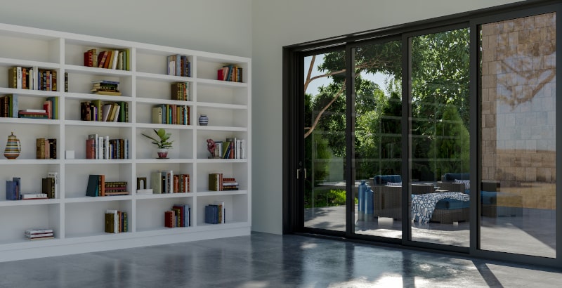 Large modern living room with 4-panel sliding patio doors offering panoramic outdoor view