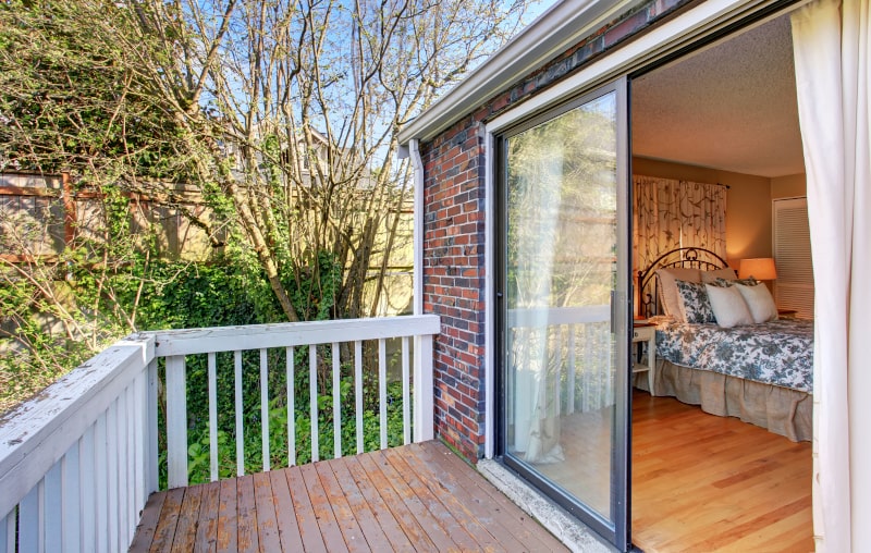 Standard sliding patio door with two large glass panels and white vinyl frame